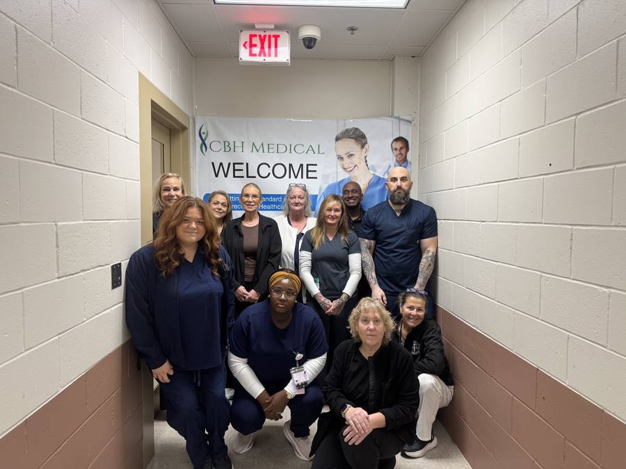 CBH Medical clinical team gathered under a CBH Medical welcome banner at the Ocean County Department of Corrections