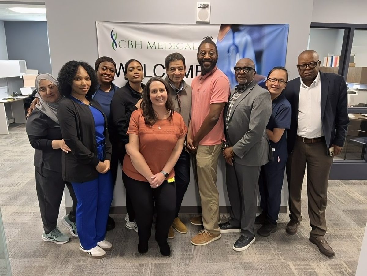 Members of the CBH Medical team gathered in front of a CBH Medical welcome banner